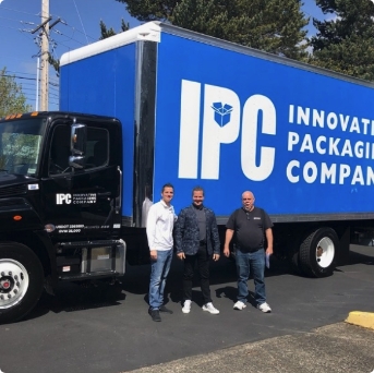 owners in front of IPC truck